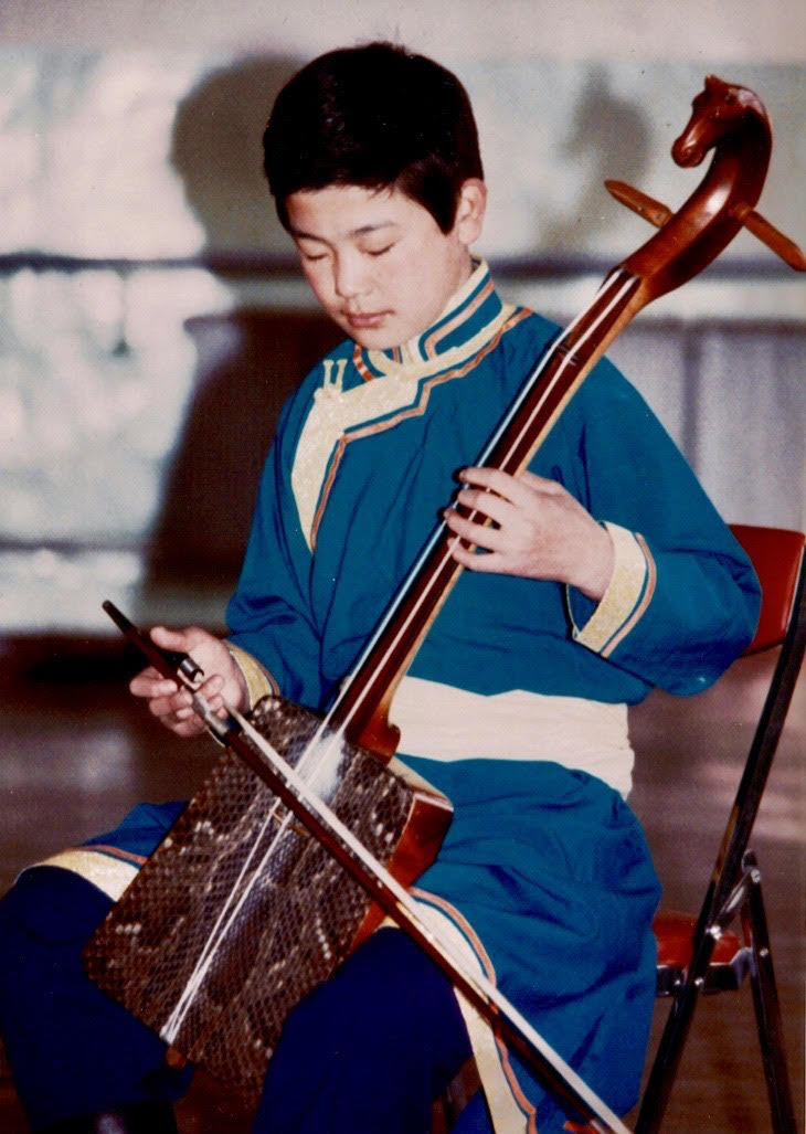 mongolian boy bow instrument